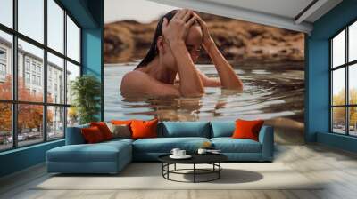 Portrait of wet woman with wet body in ocean water. Woman swim in ocean water Wall mural