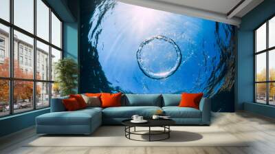 Ring bubble underwater and sun light in ocean. Water texture. Wall mural