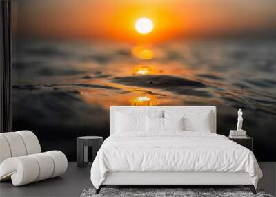 Sunset and waves in ocean. Warmy water texture with bokeh Wall mural