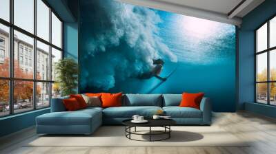 Surfer girl with surfboard dive underwater with under big ocean wave. Wall mural