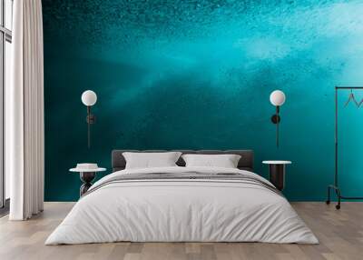 Wave with bubbles underwater. Transparent blue ocean in underwater Wall mural