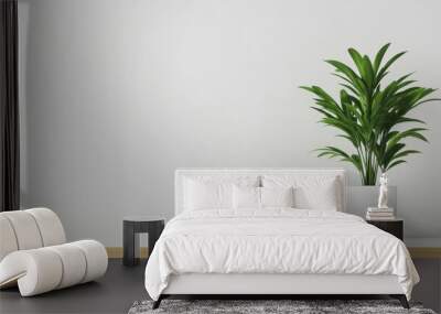 A minimalist workspace featuring a green plant in a white pot and a tablet, set on a clean, light-colored desk. Wall mural