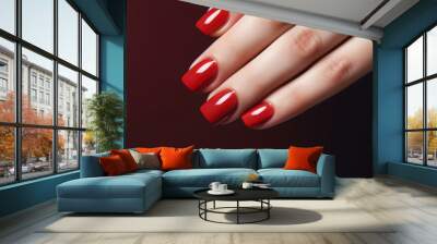 Closeup glamour woman hand with red nail polish on her fingernails. Red nail manicure with gel polish at luxury beauty salon. Nail art and design. Female hand model. French manicure. Wall mural