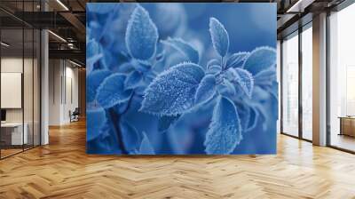 Exquisite macro shot capturing the delicate frost patterns on leaves during a crisp cold morning highlighting the intricate beauty of nature in winter Wall mural