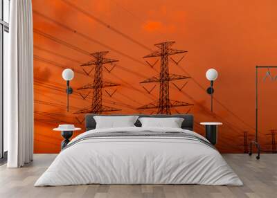 High voltage electric pylon and electrical wire with sunset sky. Electricity poles. Power and energy concept. High voltage grid tower with wire cable. Beautiful red-orange sunset sky. Infrastructure. Wall mural