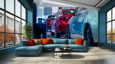 Rear view of new luxury red and white car parked in modern show room. Selective focus on white shiny car. Car dealership concept. Showroom interior. Automotive industry on coronavirus crisis concept. Wall mural