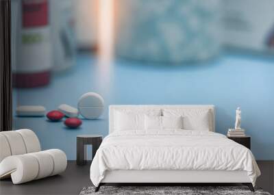 round white tablets and blurred red and white tablets pills. pills on blurred pills plastic bottle.  Wall mural