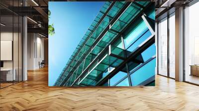 Sustainable green building. Eco-friendly building. Sustainable glass office building with tree for reducing carbon dioxide. Office with green environment. Corporate building reduce CO2. Safety glass. Wall mural