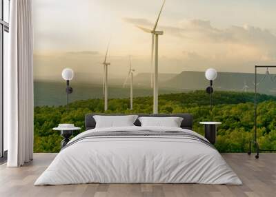 Wind energy. Wind power. Sustainable, renewable energy. Wind turbines generate electricity. Windmill farm on mountain with sunset sky. Green technology. Renewable resource. Sustainable development. Wall mural