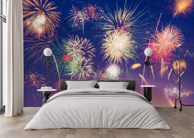 Colorful Fireworks  on blue and purple twilight background to celebrate new year or special occasions, party or events, holiday celebration concept Wall mural