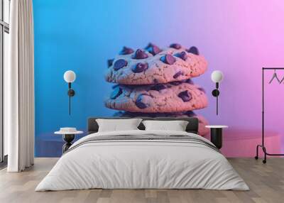 Stack of Chocolate Chip Cookies on Wooden Board with Blue and Pink Gradient Background Wall mural