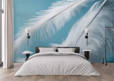 Airy soft fluffy wing bird with white feathers close-up of macro pastel blue shades on white backgro Wall mural