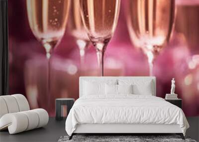 Luxurious champagne tower celebration with glasses overflowing in sparkling pink setting Wall mural