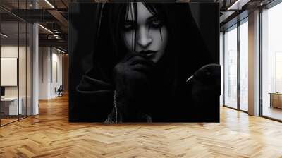 A shadowy figure in a black cloak with deep red eyes, exuding mysterious and intense vibes in a dramatic pose. Wall mural