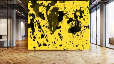 Isolated artistic black watercolor and ink paint splatter textures and decorative elements on yellow paper background. Wall mural