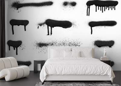 Realistic grunge graffiti spray paint effect on the white wall background. Isolated black ink texture. Wall mural