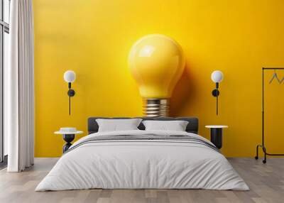 Yellow light bulb is lying on a yellow background, representing concepts like ideas, creativity, and innovation Wall mural