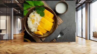 fresh ripe mango and sticky rice with coconut milk on dark background Wall mural