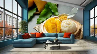 fresh ripe mango and sticky rice with coconut milk on dark background Wall mural