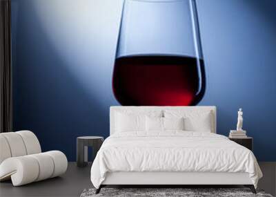 red wine in glass on blue Wall mural