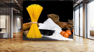 Fresh uncooked Spaghetti and pasta ingredients on a rustic table Wall mural