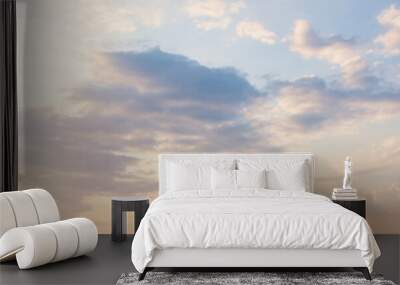 Blue sky clouds background. Beautiful landscape with clouds and orange sun on sky Wall mural