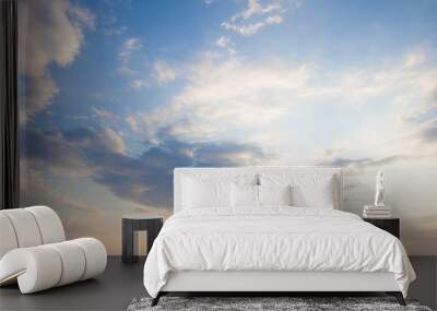 Blue sky clouds background. Beautiful landscape with clouds and orange sun on sky Wall mural