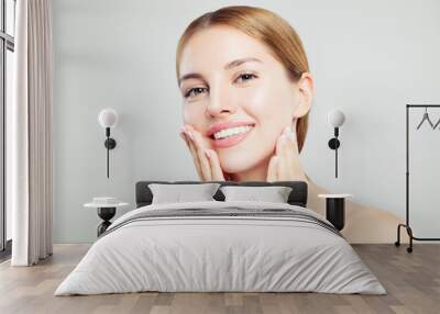 Cheerful model girl. Pretty woman face closeup. Clear skin, cute smile Wall mural