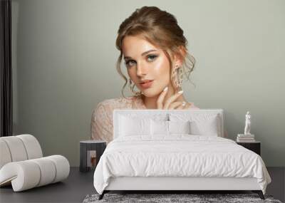 Cheerful young woman on white background Wall mural