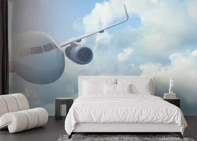 flight of an airplane. Beautiful view of a modern air liner against the sky Wall mural