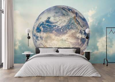 Girl holding the Planet Earth. Future Concept. Elements of this image furnished by NASA. Wall mural