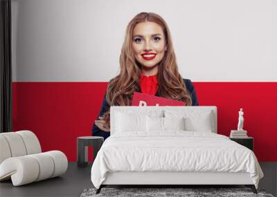 Happy girl on the Poland flag background. Travel and learn polis Wall mural