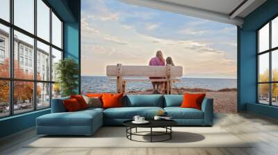 Mother and little daughter on beach. Lifestyle concept. Wall mural