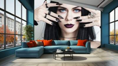 Portrait of beautiful brunette woman with black nails, halloween character Wall mural