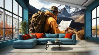 Hiker planning a hiking trip with map and other travel gear, tourism concept Wall mural