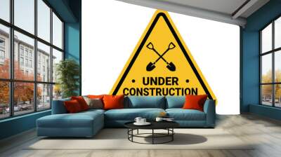 under construction on a building, shovels crossed on a yellow triangle sign. Suitable for posters and web icons Wall mural