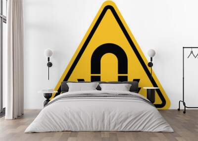 Warning strong magnetic field on a yellow triangle board. Suitable for posters and web icons Wall mural