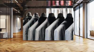 Same gray suits on a veish in close-up with a blurred background. In the store of classic clothes Wall mural