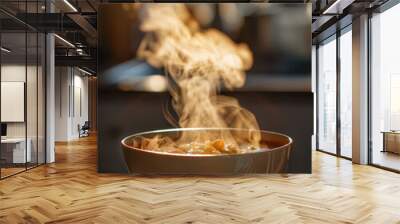 Captivating image of steam elegantly rising from a hot bowl of soup with a blurred background creating a warm atmosphere. Wall mural