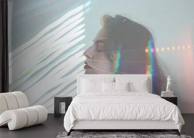 Woman face with rainbow light. Neon portrait. Beautiful girl. Glitched female face. Beauty art for fashion with young model. Blue, pink, red color. Colorful background with shadow. Wall mural