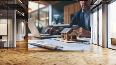 Home insurance being discussed in a property sales office with a model small building on the table AI generated illustration Wall mural