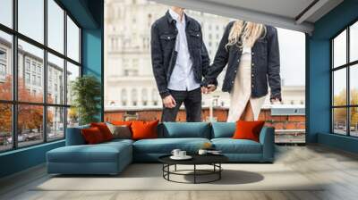 Beautiful happy young loving couple on a surprise date on a Saint Valentine's Day. Romantic modern wedding on the rooftop, summertime. Young man and beautiful girl. Newlyweds on honeymoon Wall mural