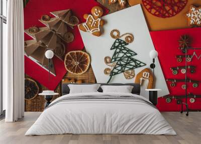 Concept of christmas holiday craft with new year fir tree embroidering with wooden thread, handmade present, postcard made with recyclable materials. Hobby, leisure time, family time. Zero waste Wall mural