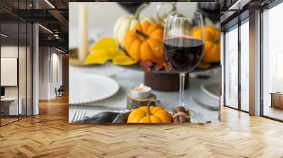 Idea for a beautiful autumn setting for thanksgiving family dinner or wedding. Orange pumpkin as decor. Cozy fall home atmosphere. Wall mural