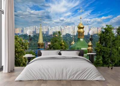 City landscape with ancient Vydubitsky Monastery, river Dnieper and modern high-rise buildings in Kyiv Wall mural