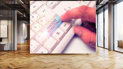 Conceptual hand writing showing Content Marketing question. Concept meaning involves creation and sharing of online material White pc keyboard with note paper above the white background Wall mural