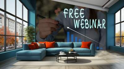 Conceptual hand writing showing Free Webinar. Concept meaning Lecture Workshop Seminar that is transmitted over the Web Woman wear work suit presenting presentation smart device Wall mural