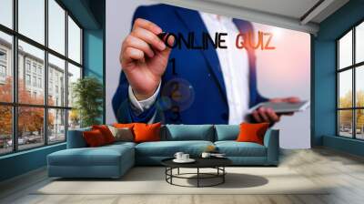 Conceptual hand writing showing Online Quiz. Concept meaning game or a mind sport that are published on the Internet Businessman blue suite and white shirt pointing with finger Wall mural