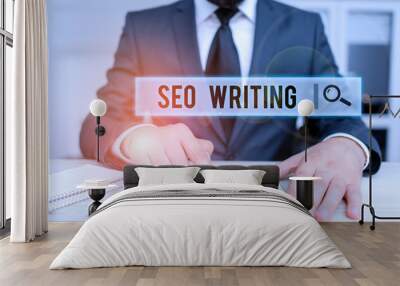 Conceptual hand writing showing Seo Writing. Concept meaning grabbing the attention of the search engines using specific word Male human wear formal clothes present use hitech smartphone Wall mural