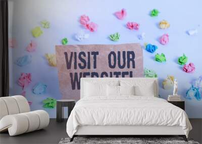 Conceptual hand writing showing Visit Our Website. Concept meaning visitor who arrives at web site and proceeds to browse Colored crumpled paper empty reminder white floor clothespin Wall mural